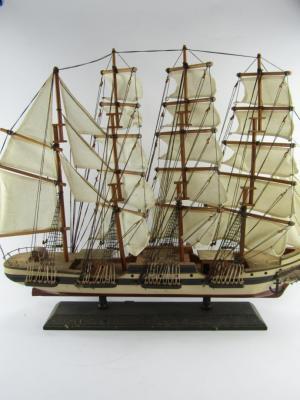 A wooden scale model of the four masted sailing ship Endeavour