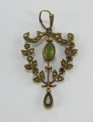 An Art Nouveau peridot and seed pearl pendant