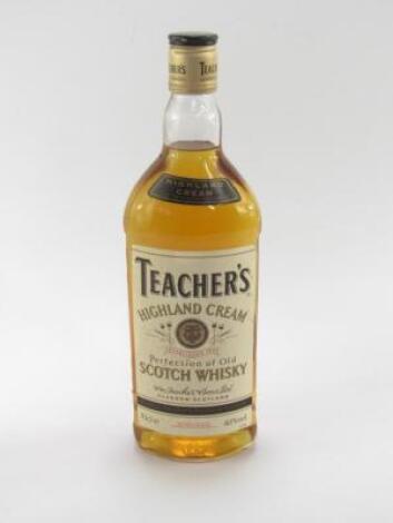 A bottle of Teachers Highland Cream Scotch Whisky.