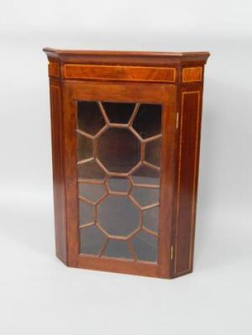 An Edwardian mahogany and satinwood cross banded wall hanging corner cupboard