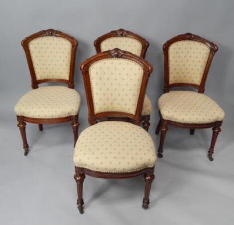 A set of four Victorian mahogany spoon back single dining chairs