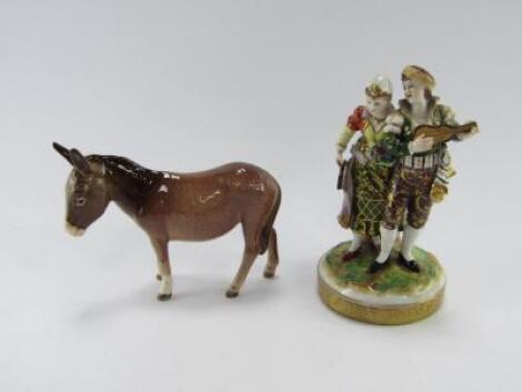 A German 20thC porcelain figure group of a pair of musicians