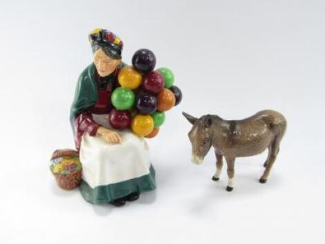 A Royal Doulton figure modelled as The Old Balloon Seller