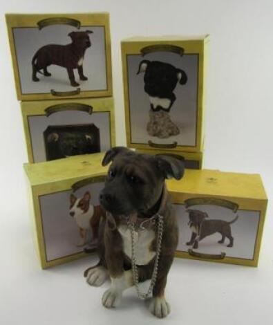 Seven Leonardo Collection models of Staffordshire Terriers