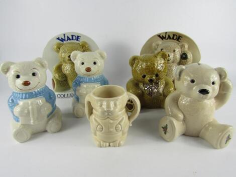 A Wade Dougie-Mac honey bear money box with a platinum bow