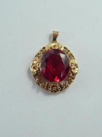 A 14ct gold and red synthetic corundum pendant