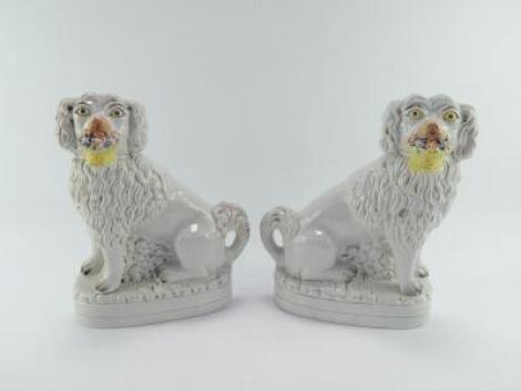 A pair of late 19thC Staffordshire flatback Spaniels