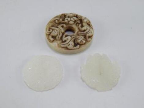 A Chinese jade pi disc carved with salamanders