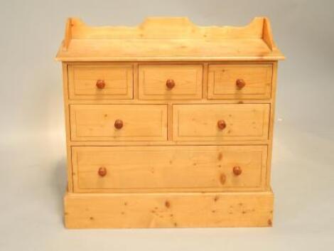 A pine narrow chest of drawers