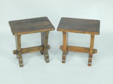 A pair of oak Arts & Crafts style joint stools.