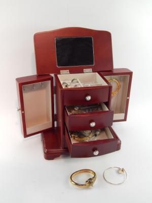 A jewellery chest containing silver and gem set rings