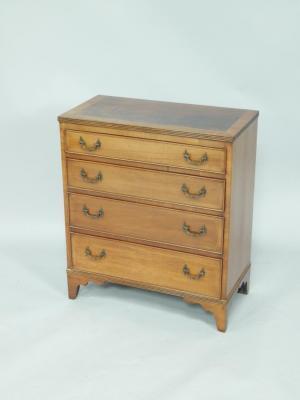 A Georgian style mahogany bachelor's chest of drawers