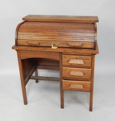 A Edwardian oak clerk's roll top desk