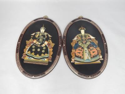 A pair of Chinese black lacquer oval plaques