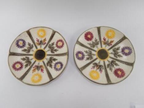 A pair of Wedgwood Majolica late 19thC plates moulded with dahlias