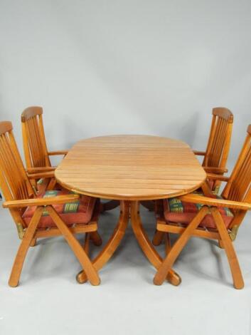 A Herlag oak oval garden dining table