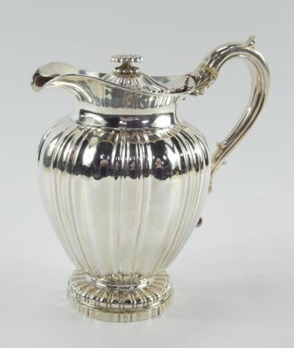 A George III silver lidded water jug