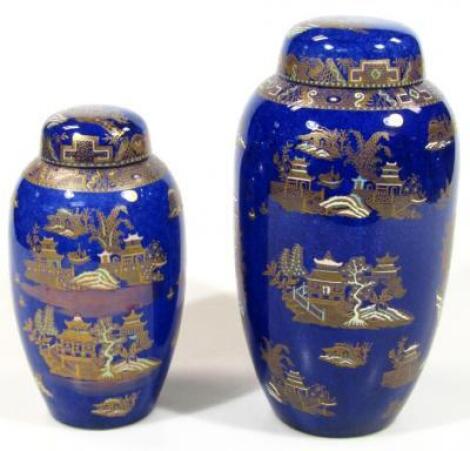 A 20thC graduated pair of Carltonware Bleu Royale Kang Hsi circular shouldered vases