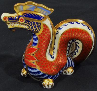 A Royal Crown Derby paperweight figure