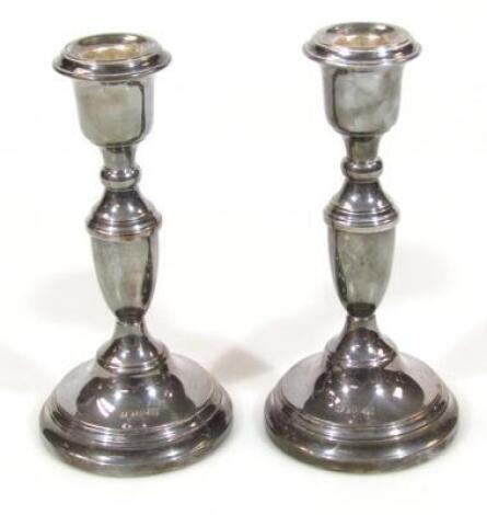 A pair of Elizabeth II silver candlesticks