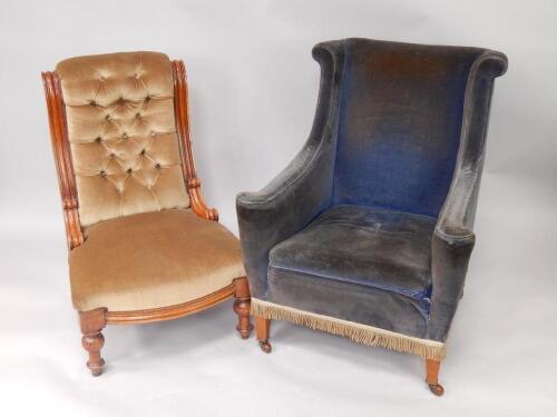 An Edwardian mahogany wing armchair