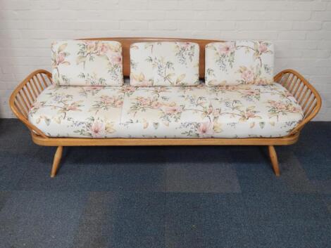 An Ercol beech and elm day bed sofa