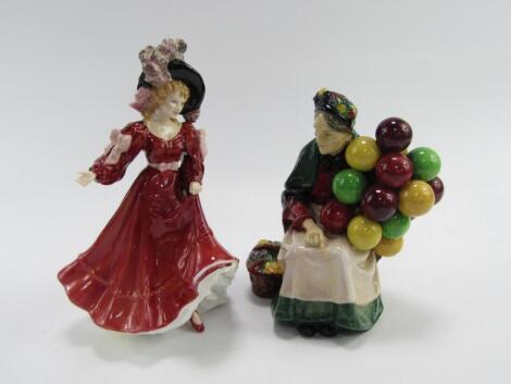 A Royal Doulton figure modelled as The Old Balloon Seller HN1315