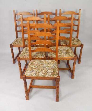 A set of six oak ladderback dining chairs