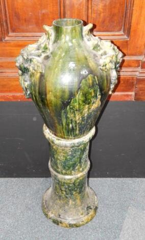 A late 19thC pottery vase on stand