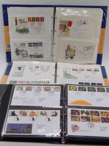 Three stamp albums including First Day Covers.