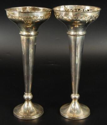 A pair of Edwardian silver stem vases