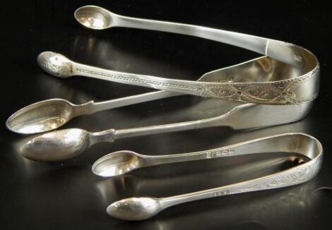 Three sets of silver sugar tongs