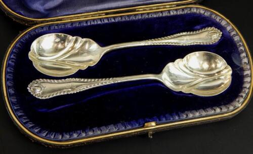 A pair of Edwardian silver serving spoons