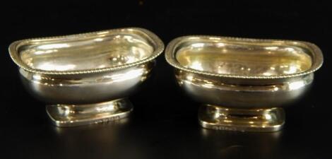 A pair of George III rectangular silver salts