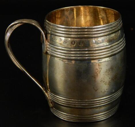 A George III silver barrel shaped christening mug