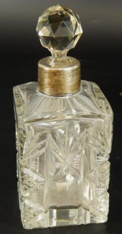 A cut glass square section scent bottle