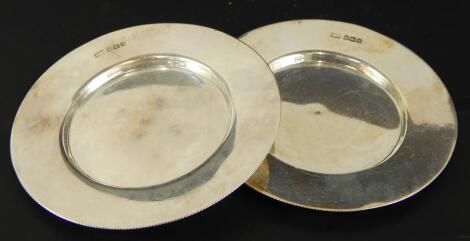 A pair of Edwardian circular dishes or pin trays