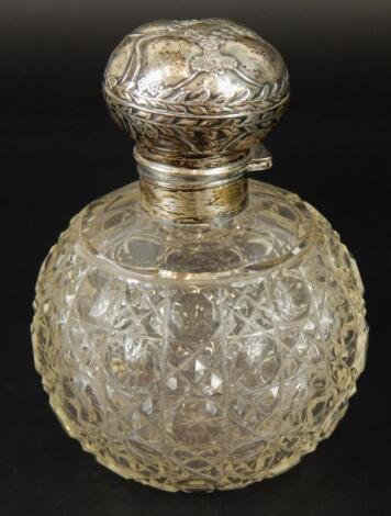 An Edwardian cut glass scent bottle