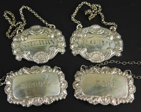 Two pairs of silver decanter labels