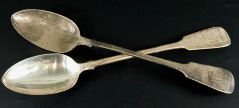 A pair of Victorian silver fiddle pattern gravy spoons