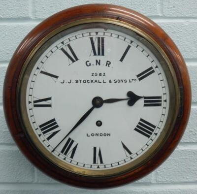 A late 19thC mahogany railway wall clock