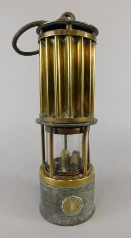 A late 19thC/early 20thC brass and iron miner's lamp