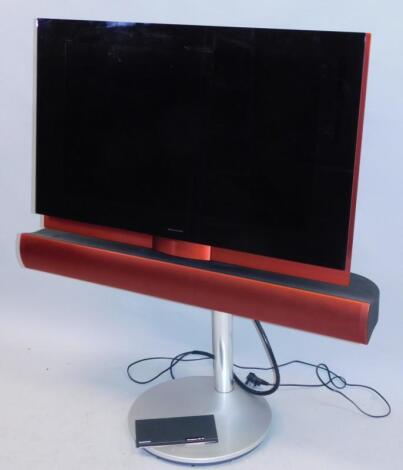 A Bang & Olufsen red and black television