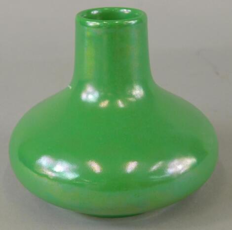 A Ruskin green lustre glazed squat bottle vase