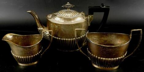 A late Victorian silver part fluted small tea set