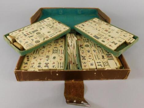 A mid to early 20thC bone and bamboo mahjong set