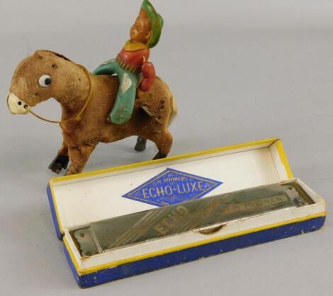 A Japanese clockwork toy cowboy and horse