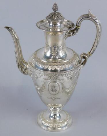 A late 19thC silver plated coffee pot