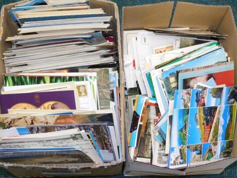 A large quantity of colour and black and white postcards