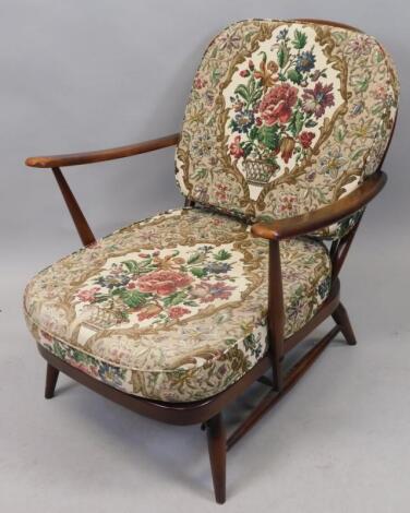 An Ercol cottage style open armchair